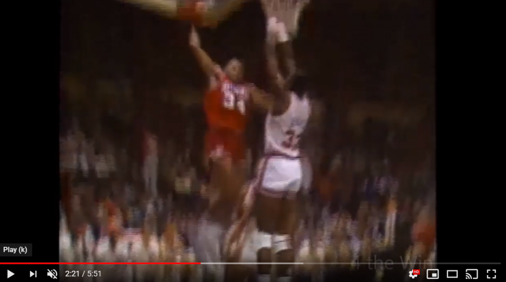 Charles Barkley dunking on Patrick Ewing